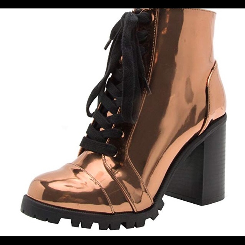 Lace up round toe stacked block heel ankle boots.